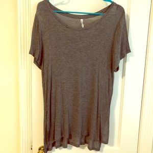 Gray tee with deep vents on the sides